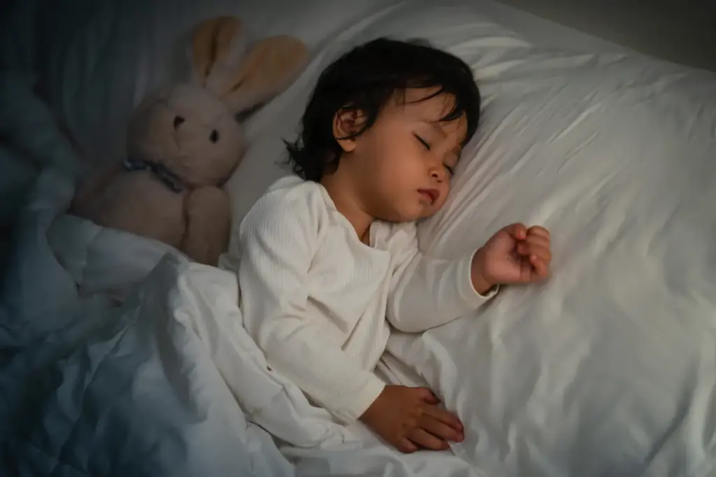 Baby Sleeping With A Teddy Bear 