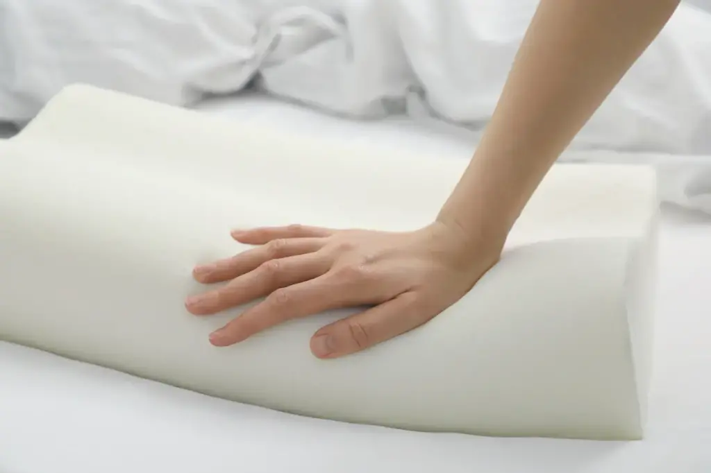 Hand Pressing on Memory Foam Pillow 