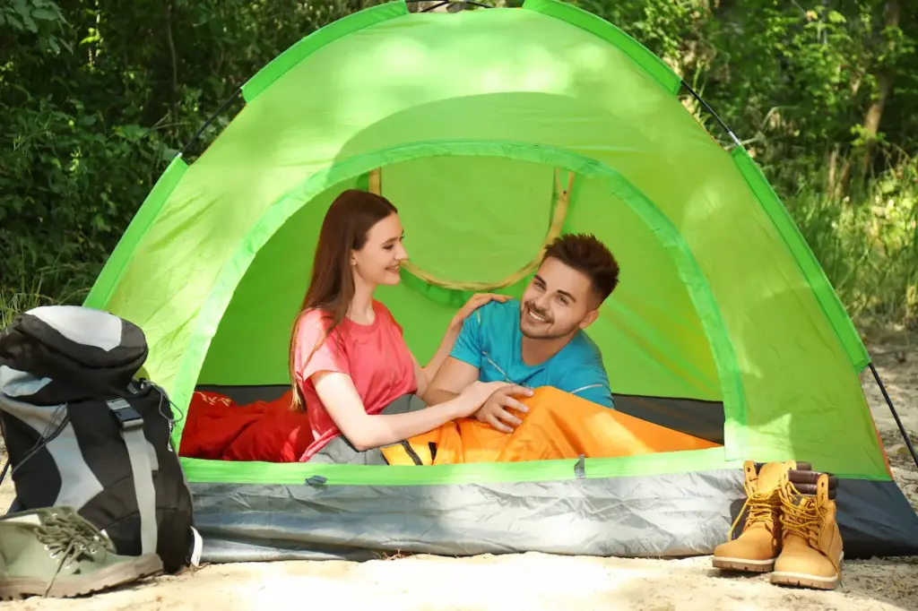 Young Couple Inside A Camping Tent