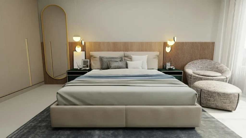 A Large Bed in a Bedroom Next to a Chair