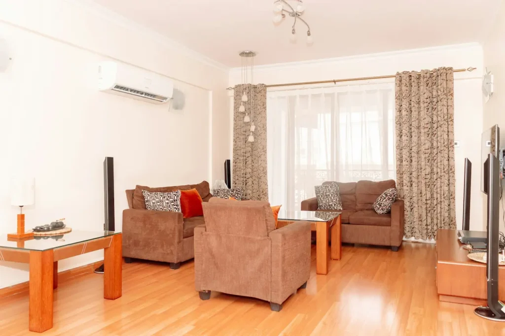 A Living Room with Furniture and Air Conditioning 