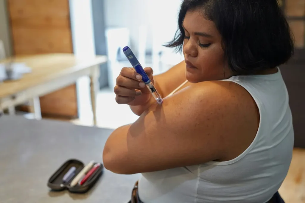 A Person Using an Insulin Injection Pen for Diabetes 