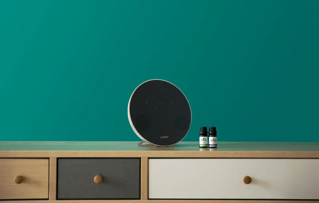 A White Noise Machine on A Wooden Cabinet