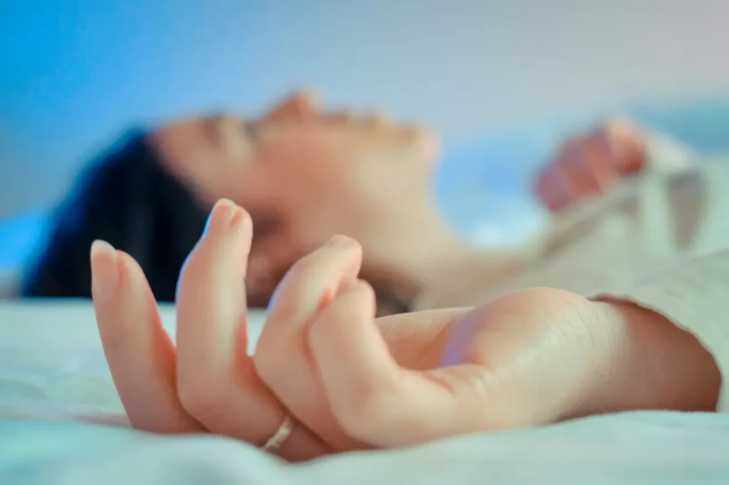 Girl Lying Awake on Bed with Blurred Background